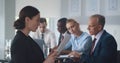 Young beautiful businesswoman reading contract at meeting in office Royalty Free Stock Photo