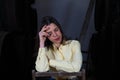 Young beautiful businesswoman sitting on a chair in her wine cellar. The woman is making different expressions and gestures Royalty Free Stock Photo