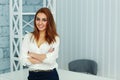 Young beautiful businesswoman standing with arms folded Royalty Free Stock Photo