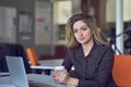 Young and beautiful businesswoman tired from work in the office.Woman holding her head. Royalty Free Stock Photo