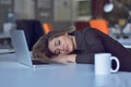 Young and beautiful businesswoman tired from work in the office.Woman holding her head. Royalty Free Stock Photo