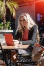 Young and beautiful businesswoman using her digital tablet in ca Royalty Free Stock Photo