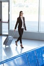 young beautiful businesswoman walking with baggage Royalty Free Stock Photo