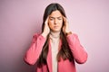 Young beautiful businesswoman wearing casual turtleneck sweater and jacket suffering from headache desperate and stressed because Royalty Free Stock Photo