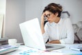 Young beautiful businesswoman working with laptop at workplace in office. Royalty Free Stock Photo