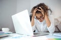 Young beautiful businesswoman working with laptop at workplace in office. Royalty Free Stock Photo