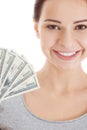 Young beautiful casual woman holding large sum of money. Royalty Free Stock Photo