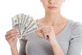 Young beautiful casual woman holding large sum of money. Royalty Free Stock Photo