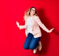 Young beautiful caucasian businesswoman wearing jacket and glasses smiling happy Royalty Free Stock Photo