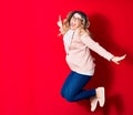 Young beautiful caucasian businesswoman wearing jacket and glasses smiling happy Royalty Free Stock Photo