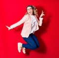 Young beautiful caucasian businesswoman wearing jacket and glasses smiling happy Royalty Free Stock Photo