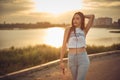 Young beautiful caucasian girl listening to music with smartphone walking in the city with headphones smiling - relax, youth, Royalty Free Stock Photo