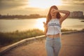 Young beautiful caucasian girl listening to music with smartphone walking in the city with headphones smiling - relax, youth, Royalty Free Stock Photo