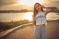 Young beautiful caucasian girl listening to music with smartphone walking in the city with headphones smiling - relax, youth, Royalty Free Stock Photo