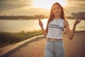 Young beautiful caucasian girl listening to music with smartphone walking in the city with headphones smiling - relax, youth, Royalty Free Stock Photo