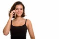 Young beautiful Caucasian teenage girl talking on mobile phone Royalty Free Stock Photo