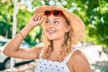 Young beautiful caucasian woman with blond hair smiling happy outdoors on a summer day wearing sunglasses Royalty Free Stock Photo