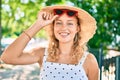 Young beautiful caucasian woman with blond hair smiling happy outdoors on a summer day wearing sunglasses Royalty Free Stock Photo