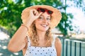 Young beautiful caucasian woman with blond hair smiling happy outdoors on a summer day wearing sunglasses Royalty Free Stock Photo