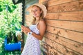 Young beautiful caucasian woman with blond hair smiling happy outdoors using smartphone Royalty Free Stock Photo