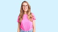 Young beautiful caucasian woman with blond hair wearing casual clothes and glasses with a happy and cool smile on face Royalty Free Stock Photo
