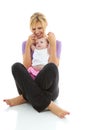 Young beautiful caucasion mom doing baby yoga Royalty Free Stock Photo