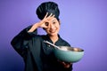 Young beautiful chinese chef woman wearing cooker uniform and hat using bowl and whisk with happy face smiling doing ok sign with Royalty Free Stock Photo