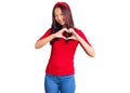 Young beautiful chinese girl wearing casual clothes and diadem smiling in love showing heart symbol and shape with hands Royalty Free Stock Photo