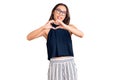 Young beautiful chinese girl wearing casual clothes and glasses smiling in love showing heart symbol and shape with hands Royalty Free Stock Photo