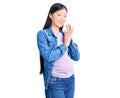 Young beautiful chinese woman pregnant expecting baby clapping and applauding happy and joyful, smiling proud hands together Royalty Free Stock Photo