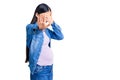 Young beautiful chinese woman pregnant expecting baby covering eyes with hands and doing stop gesture with sad and fear expression