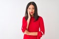 Young beautiful chinese woman wearing red dress standing over isolated white background thinking looking tired and bored with Royalty Free Stock Photo