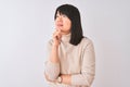 Young beautiful chinese woman wearing turtleneck sweater over isolated white background looking confident at the camera smiling Royalty Free Stock Photo