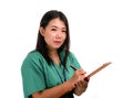 Young beautiful and confident Asian Chinese medicine doctor or hospital nurse woman holding medical reports clipboard wearing Royalty Free Stock Photo