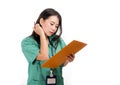 Young beautiful and confident Asian Chinese medicine doctor or hospital nurse woman holding medical reports clipboard wearing Royalty Free Stock Photo