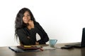 Young beautiful and confident black afro American businesswoman working at office computer desk looking bossy and relaxed in woman Royalty Free Stock Photo