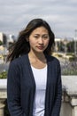 Young beautiful confident woman looking at camera standing outdoors. Determined lady staring at camera in a casual style Royalty Free Stock Photo