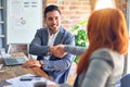 Young beautiful couple of business workers smiling happy and confident Royalty Free Stock Photo