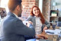 Young beautiful couple of business workers smiling happy and confident Royalty Free Stock Photo