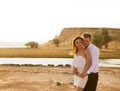 Young beautiful couple dancing on the background of sunset Royalty Free Stock Photo