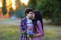 Young beautiful couple embracing and smiling at sunset in summer Royalty Free Stock Photo