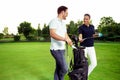 Young couple enjoying time on a golf course Royalty Free Stock Photo