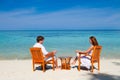 Young beautiful couple enjoying on a tropical beach Royalty Free Stock Photo