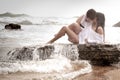 Young beautiful couple flirting and kissing at the beach Royalty Free Stock Photo