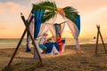 Young beautiful couple have a romantic dinner at sunset on a tropical beach . Honeymoon. Royalty Free Stock Photo