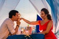 Young beautiful couple have a romantic dinner at sunset Royalty Free Stock Photo