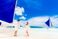 Young beautiful couple having fun on a tropical beach . Tropache Royalty Free Stock Photo