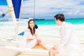 Young beautiful couple having fun on a tropical beach . Tropical Royalty Free Stock Photo