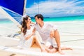 Young beautiful couple having fun on a tropical beach . Tropical Royalty Free Stock Photo