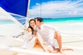 Young beautiful couple having fun on a tropical beach . Tropical Royalty Free Stock Photo